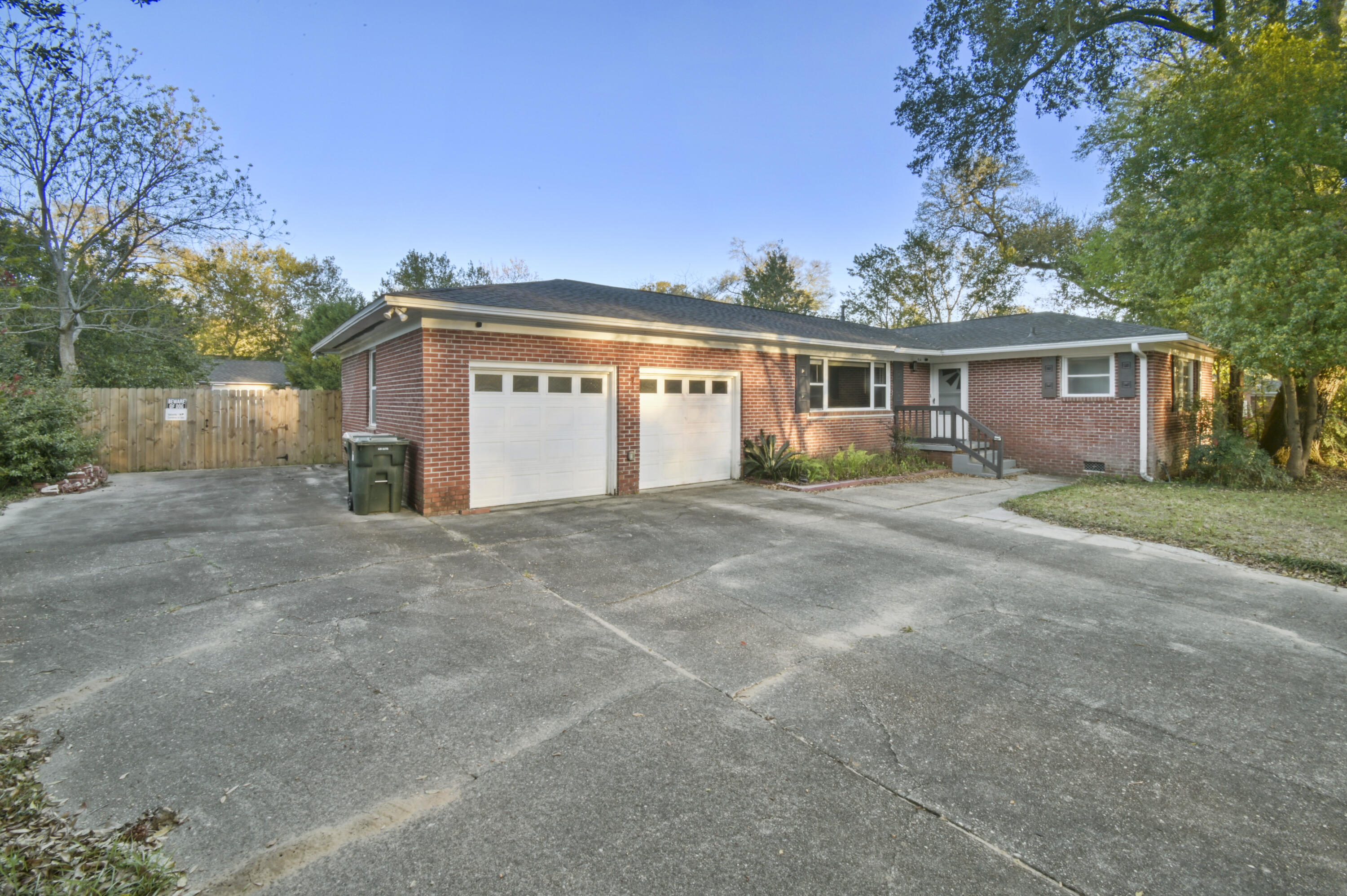 This beautiful home is located on a quiet road on 1/3 OF AN ACRE, minutes away from everything the area has to offer! Upon driving up to the property you will immediately notice the abundance of parking options - a huge driveway, an oversized 2-car garage, and a large concrete slab with a double gate - perfect for RV/boat parking! Take note - 2019 ROOF & NO CARPET THROUGHOUT! Walking inside you are greeted by an abundance of natural light shining through to the spacious living/dining room, perfect for entertaining guests! Just off of the dining area is the kitchen, designed for the family chef in mind. With a large central island, this kitchen comes equipped with every appliance you would need, tons of cabinetry, and a window overlooking the backyard. The master bedroom is easily big enough for a king bed and features an en-suite full bathroom. Each of the additional 3 bedrooms are large enough for queen beds and have sizeable closet space too. The oversized 2-car garage doubles as a workshop, with a massive amount of space for storage and hobbies. Stepping out back into the large fenced backyard, there is unlimited potential! There are two storage sheds for tools/equipment, a green house, a large patio, and a shaded spot with a bench overlooking a birdbath allowing you to relax with a cup of coffee and enjoy the birdsongs all around! Easily room for a pool or any project you may have in mind! This home has it all and is the cheapest turnkey home with a 2-car garage in all of Escambia county! Stop by and make this house your home!