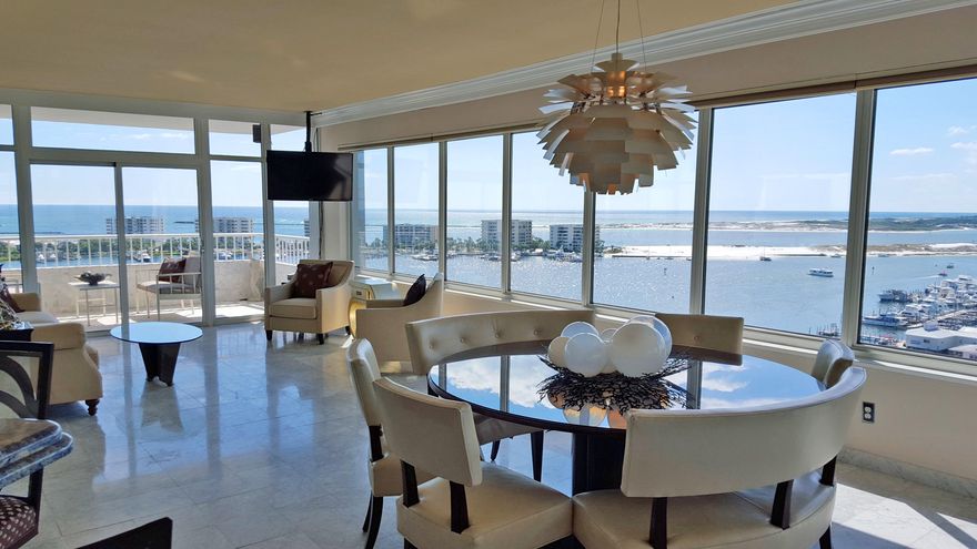 Touches of sophistication and the inspiration of coastal elegance were the perfect finishing touches to one of the most renowned four bedroom penthouses overlooking Destin's most sought after views.Dangling 11 stories over the harbor ''Fleur de la Mer'' is on the far west end of Destin Yacht Club allowing for the most spectacular unobstructed sunset views over Crab Island, the Harbor and all the way to the Bay.The evenings are perfect for gatherings or entertaining, the views over the harbor twinkle with lights from the yachts and on Thursday nights and special events the fireworks from Emerald Grand look as if the show was just for you and your guests as the fireworks light up the night.Fleur de la Mer features a deep water boat slip accommodating up to a 90 ft yacht and is offered fully