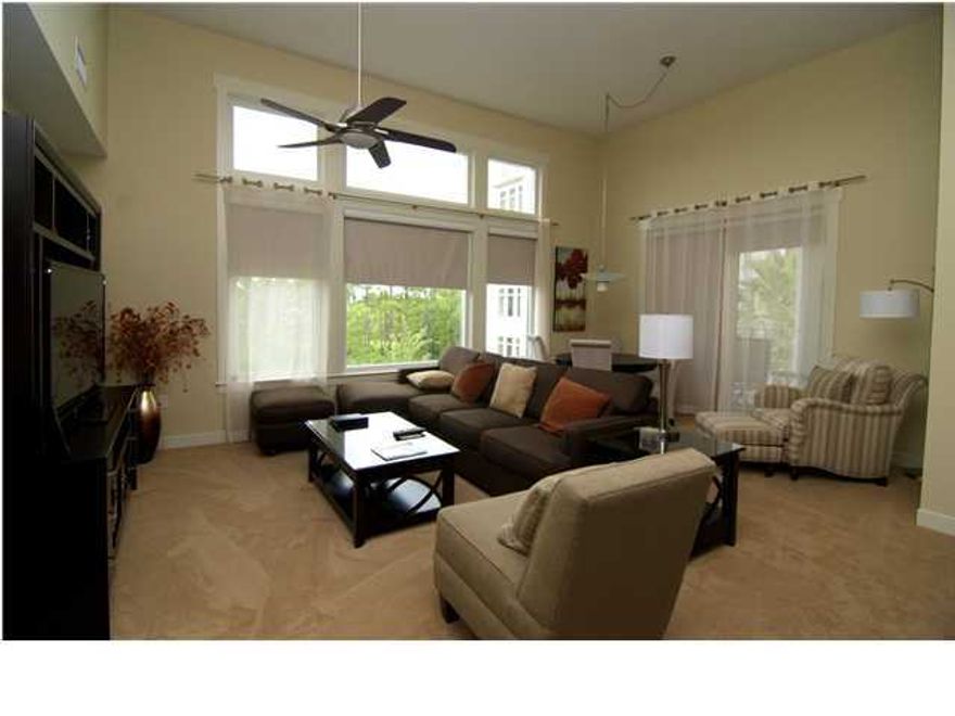 Gorgeous one of a kind Bahia condo with high ceilings and wonderful bay views. New carpet throughout, window treatments, new bathroom vanity, new furnishings,flat screen TV's and accessories all set it apart from the basic village condo. It must be seen to be appreciated. Add to all this a quiet corner location with private balcony on which to relax and enjoy bay views. Bahia owners enjoy access to the private Solstice Club on the bay, large owners storage area and underground parking.