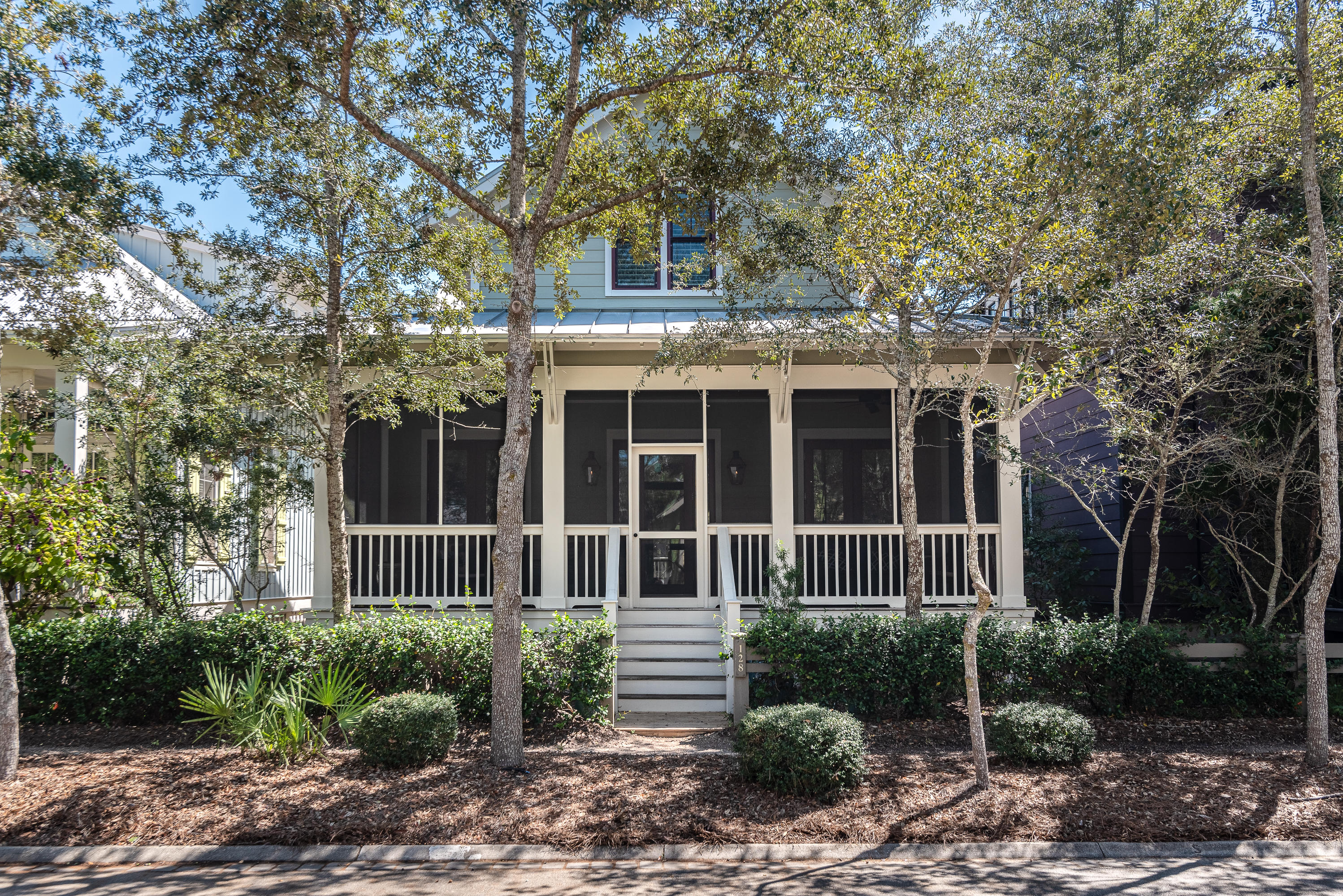 Comfort and convenience in a beautiful Beach District cottage. 128 Mystic Cobalt is the perfect residence or investment property for someone who wants a low maintenance home close to the sand, and to all that Phase 1 of WaterColor has to offer. Vaulted ceilings give the open floor plan additional light and a greater sense of space. The home's 3 bedrooms each have their own en suite bath. An attached garage affords covered parking and additional storage. Front and rear screened porches are perfect for reading a book, outdoor dining, or for extending the main living space. This is just the right house in an excellent location.