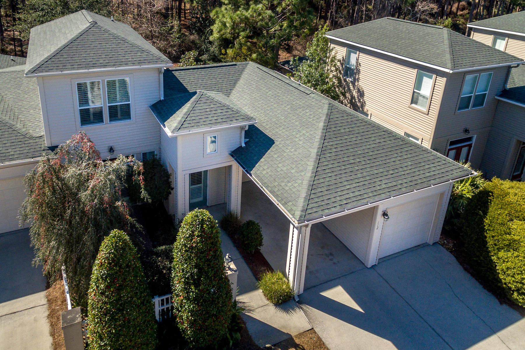Lovely townhome located within the Courtyards of Santa Rosa Beach, a gated neighborhood offering a community pool and located just 1/2 mile from the Santa Rosa Golf & Beach Club and a quick 5 minute ride to the beach. This home offers ample parking with an oversized driveway, carport and a single car garage. The interior is bright and welcoming with an open concept marrying the kitchen, dining and living area into the perfect family space. Enjoy a new HVAC, new washer/dryer, gas fireplace, tile throughout the living area, new screened porch, 1st floor master bedroom and french doors leading to two separate courtyard spaces. The main floor also offers an addition guest bedroom suite, powder room and laundry room with the 2nd floor allocated to a large guest bedroom and private bath.