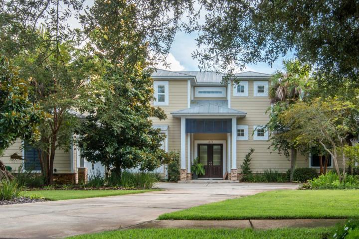 Priced below appraisal. Coastal Chic describes this 7 bed 5 bath home with 100' of protected deep water on Desirable Indian Bayou North leading to Bay. Covered Docks for large (50') as well as small vessel/watercraft, outdoor kitchen, fireplace, pool and spa. Gorgeous Reclaimed wood flooring throughout. Breathtaking Live Reef 330 gallon fish tank in open eat-in gourmet kitchen. Large dining area with built-ins. Separate entrance, Butler's pantry, mud room, 1st floor bedroom/office, full bath with teak floor shower leads to pool area. French doors in First Floor Master lead to pool. Dramatic stone fireplace, cathedral ceiling, exposed beams, and paddle fan featured in Living Room. Abundant light throughout. Five bedrooms 2nd floor (one exercise room). Home is wired for a generator.