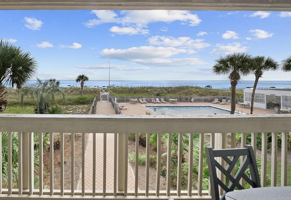 Capture an unmatched beach lifestyle located six minutes from 30A! This peaceful sanctuary on the water provides a spectacular view of the Emerald Coast. This stunning getaway can be a coastal escape for you and your family as well as a top-producing rental property. This property showcases a 240 SF beachfront balcony allowing for incredible views. Conveying fully-furnished, the property is rental-ready. Perfectly positioned near the community pool, Unit 49 features the rare single-level floor plan with an oversized guest bedroom. Beautifully designed, the condominium displays a modern blend of indoor and outdoor living. This exceptional unit enjoys a private beach with over 600 FT of protected beaches owned by the association. The development includes covered parking as well as recent exterior upgrades such as new sliding glass doors, new windows, new street-side balconies and you'll have new beachfront balconies coming soon at no cost to buyer. Explore this sanctuary designed for relaxation, connection and unforgettable memories on the coast!