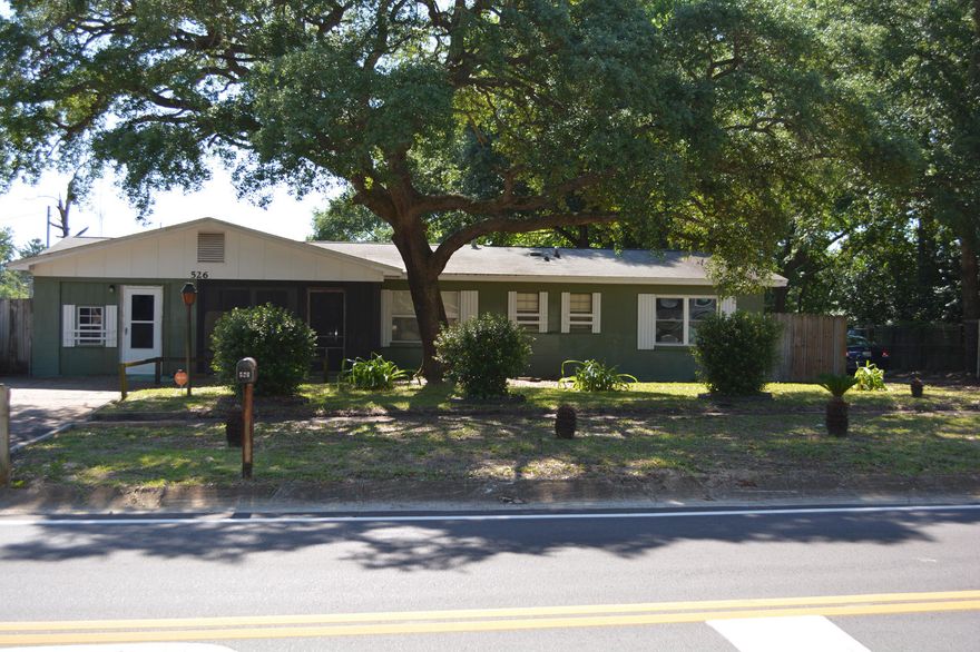 If you are looking for a spacious affordable family home in an established neighborhood, then 526 JUSTIN STREET is it. This 4 bedroom, 1.5 bath home sits on a corner lot and has approx 1668 sq ft, a formal living room, a family/den area, a kitchen with eat-in dining and an indoor laundry area. There is an enclosed room extending from the eat-in kitchen that is not included in the living area. The large lot includes a beautiful front yard and a side yard ready for gardening with raised sprinklers and an arbor complete with grape vines. The backyard structure includes a workshop and two storage areas. Great location with easy access to Hurlburt, Eglin, shopping, schools, and more! THIS HOME NEEDS SOME TLC and IS OFFERED AS IS HOWEVER IT HAS GREAT POTENTIAL. DON'T MISS THIS OPPORTUN