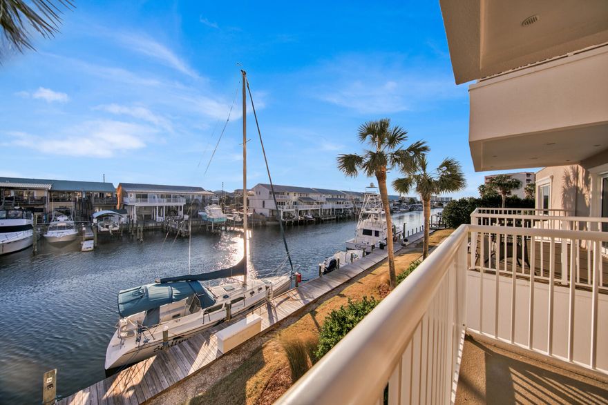 Located on the coveted Destin Harbor, it's hard to find a better location than Sun King Towers & Yacht Club. Surrounded by the Harbor and canal, this gated complex is any water lover's dream. Have a boat, just a short walk/golf cart ride to the beach, large pool, club house with kitchen & exercise room. This spacious condo has 2 bedrooms, 2 baths and 2 balconies. Each unit comes with a large storage closet located in the garage which holds plenty of fishing gear and beach toys. Sun King Towers boasts its own boat launch as well as a private marina with available boat slips for owners. Sun King Towers is a well kept complex with recent resurfaced parking lot, sealed and water proofed balconies, hurricane doors & windows & painted exterior of building.