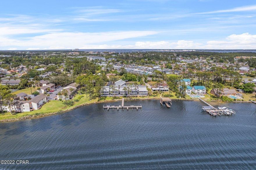 UNDER CONTRACT W/ CONTINGENCIES; SELLER ACCEPTING BACKUP OFFERS.Waterfront & Boat Lovers Dream. Own your piece of paradise in this Newly Updated Condo. Located on Grand Lagoon in Panama City Beach. Boaters can enjoy the use the dock when you are here for the week, or weekend as desired. Don't miss out on this super cute condo, it won't last long. Two bedroom, Two bath, over looking the lagoon, and serenity of the east end of Panama City Beach. No vacationers coming and going here. Quiet neighborhood to live in while enjoying Florida's best beaches, and waterfront amenities. This second Floor condo, offers lots of privacy, no one living above you. The HOA is $364 per month. Fee's include the exterior property insurance, water, trash, pest control, pool, and dock use.