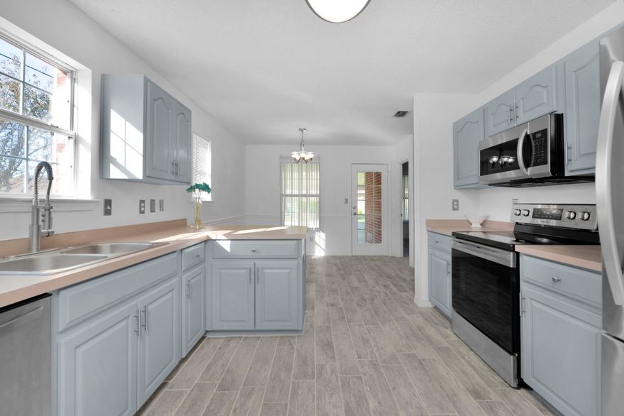 Move in ready ALL BRICK HOME on Corner lot, desirable commute & location,  features a wood burning fireplace as soon as you walk in. Open floor plan & a fully enclosed sunroom porch for bonus usable space! Must see 3 bed/2 bath home located in Waterford Estates in Mary Esther! Conveniently located with easy access to Hurlburt Field, beaches, and shopping.BRAND NEW ROOF 10/20/2021 A/C 2017All new Appliances, and gorgeous all new tile flooring throughout the home.