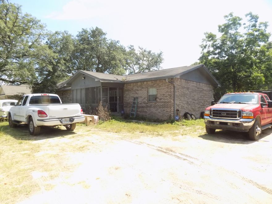 .72 acres of residential property. Centrally located in Ft. Walton Beach close to shopping, restaurants and near all bases. Three bedroom, 2 Bath brick home sits on property with fenced yard and detached metal carport included. Home is vacant and is need of repair. Selling As Is. 2 acre parcel directly across is also being sold by this seller and can be sold together or separate.
* Home does not come with a refrigerator*