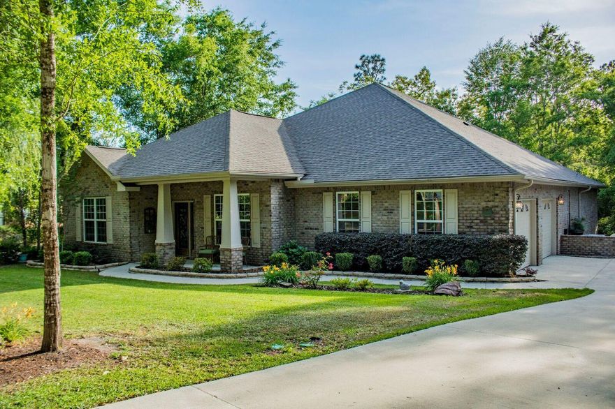 This beautiful custom home is located in the desirable Juniper Creek Subdivision. Just 15 minutes from Duke AFB and 7th Group Compound !The kitchen is a must see! Fully equipped with double ovens, a customized 5 burner gas range, upgraded wall range hood, stainless steel whirlpool appliances, trash compactor, granite counter tops, an island, a bar top and a large walk in pantry. There are TWO master suites, each has its OWN bathroom and a large walk in closet. The home has wood flooring; the main entrance has 10ft ceilings and the remaining space has 9ft ceilings. The office has French doors for privacy, the formal dining room has a butler entrance and the spacious living room has a gas fireplace.The laundry room comes equipped with a sink, hidden ironing board, sewing