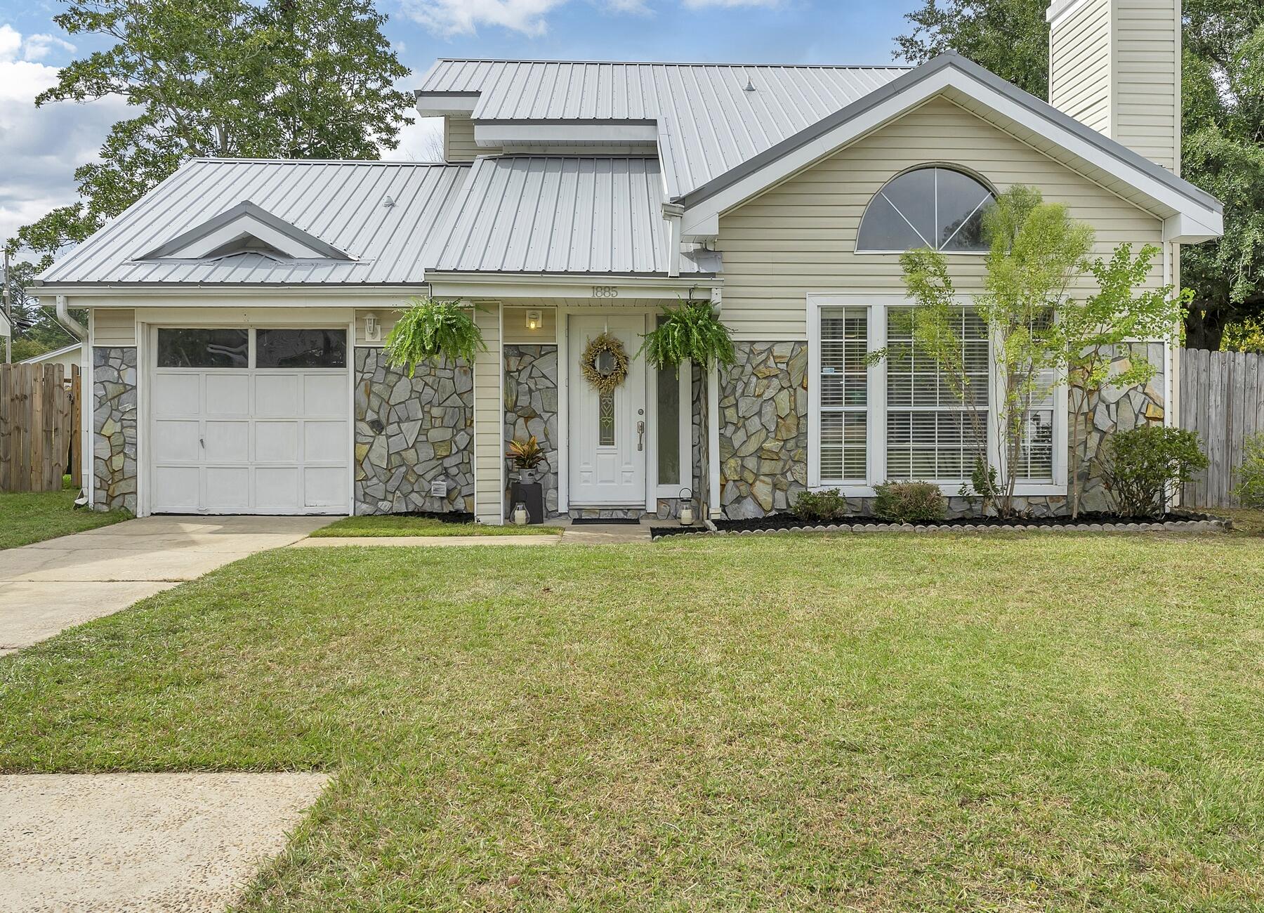 Charming Family Home in Desirable Green Acres Subdivision!This beautifully maintained home offers an ideal combination of comfort, style, and convenience. New metal roof installed in 2022 will give more options for affordable home insurance.Step into a home with newly painted walls, trim, and freshly sealed grout that radiates warmth and freshness. The main living area boasts elegant tile flooring throughout, creating a seamless and low-maintenance space. The kitchen features stainless steel appliances, abundant counter space, and an open design that makes meal preparation a breeze.The inviting living area features vaulted ceilings and a charming wood-burning stone fireplace, creating the perfect setting for cozy evenings. Storage space ensures you have room for cherished items. The master bedroom located on the main floor is a peaceful retreat with sliding glass doors leading to the backyard and patio. While the upstairs bedrooms are ready for your personal touch, the seller is offering a flooring allowance at closing with an acceptable offer. The convenience of a washer and dryer included in the sale makes daily chores a breeze.
Enjoy year-round relaxation in the sunroom, a versatile space that can be used for leisurely dining, unwinding, or exploring new hobbies.
The backyard is a private haven, enclosed by a privacy fence. It offers ample room for your dreams of a pool, outdoor kitchen, or lush garden.
Conveniently located just 7.5 miles from Eglin Air Force Base, this home is a perfect choice for military personnel.
You're also only 7.8 miles away from the Okaloosa Island Pier and the stunning beaches of the Emerald Coast.
The neighborhood offers easy access to shopping and is surrounded by award-winning restaurants for your dining pleasure.
Contact your favorite realtor today to schedule a showing and turn your dreams into reality. Your future begins here!