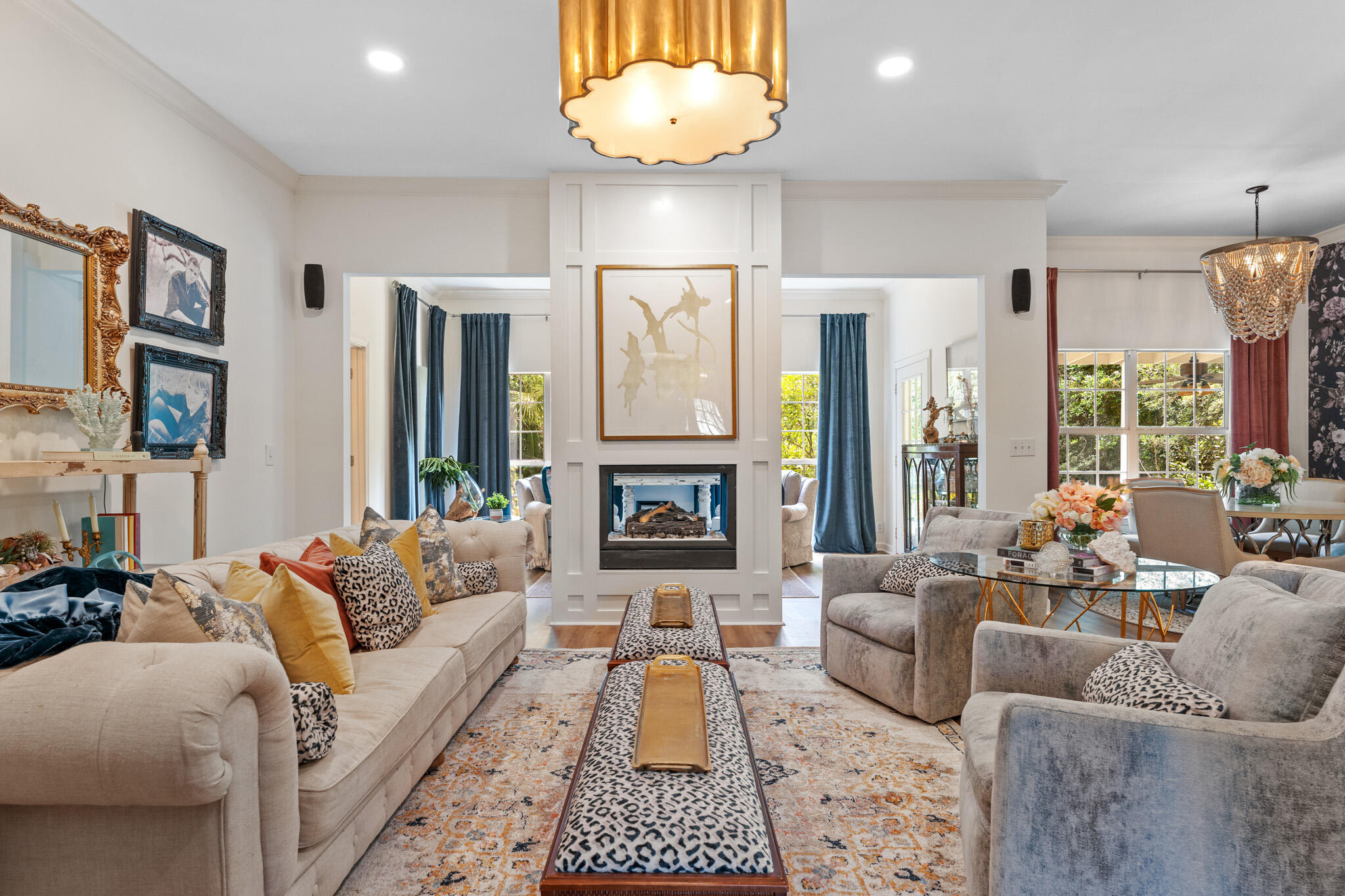 Enter this idyllic Seabreeze cottage through a glass-paned antique wood door which opens to a contemporary designer's dream. A stunning see-through white fireplace centers the living room and large windowed sitting area. The open floor plan makes use of all the space while allowing for the flow of sunlight from the backyard Eden. The beautiful kitchen brings a European seaside cottage to mind with a full floral wall-mural, brand new appliances and authentic Hicks pendant lighting. Nothing about this interior is average. Soft, cozy and stunning are words that best describe the vibe of this darling three-bedroom two-bath house on a beautifully treed oversized lot. The owner's suite is a peaceful retreat with a large stand-alone soaking tub and walk-in shower. Wake up facing a garden view with orange, lime, lemon, peach and fig trees just outside the large window facing the backyard. The spacious & lush backyard has room to add a pool & is surrounded by a privacy fence. The two front bedrooms are generous with beautiful views of the front porch and the award-winning front yard. One room holds twin beds with custom painted French headboards. The larger front room is suited with a beautiful king bed, white marble side tables and large flat screen television. The two front bedrooms have remote controlled ceiling fan light fixtures while the owner's suite is fitted with a crystal fandelier that is both beautiful and functional. The lighting throughout the house is Aiden Gray, Visual Comfort, Pottery Barn and Hicks by Thomas O'Brian. Perfectly situated to hear the roar of the waves at night and yet escape the steady flow of vacationers. This home is located in a serene neighborhood for 30A locals. The famous 30A is only 0.20 miles away where you can take a stroll or drive in the provided Golf Cart to the deeded beach access & enjoy the renowned emerald green waters and white sandy beaches. Enjoy Camp Creek Lake with accessible path off Seabreeze Ct. to fishing, paddle boarding, kayaking & more. Seabreeze Community, with its gazebos, lending libraries, holiday celebrations, private beach access and friendly neighbors is the dream people write about. ( ie. Camino Island by John Grisham) This newly imagined, renovated, fully furnished gem is steps from the Emerald Coast and available just in time for summer. The whole package without the hassles of moving can be yours. The exquisite property is coming furnished, less sellers exclusions. Custom Restoration Hardware, Bernhardt and Aiden Gray furnishings are included as art, lamps, three flatscreen televisions and custom 5.1 surround sound system in the living room. 30A living couldn't be an easier or more beautiful choice.
