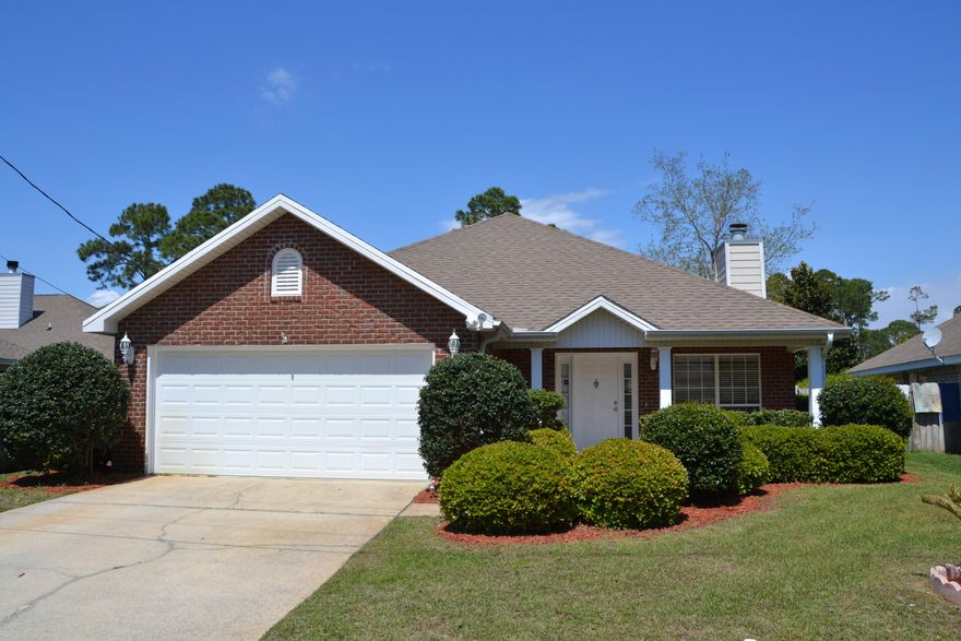 This is a beautiful 3 bed 2 bath home located in the heart of Miramar Beach. Just a short drive to the beach. Even close enough to bike to the beach! This home has a open floor plan when you walk in the house. It opens up to the living room, kitchen, and dining room. There are two good sized additional bedrooms with a full bath. Along with a master bedroom with a large walk in closet. Also attached is the master bathroom. You can also access the back porch from the master bedroom. This home has a oversized two car garage. The lot this house sits on is one of the largest in Olde Florida Lakes subdivision. The backyard is fully fenced in and is great for entertaining, or letting the kids have a safe place to play! Plenty big enough to add a pool if desired.