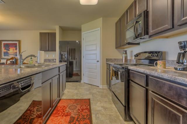 The Cali is a one story floor plan featuring 4 bedrooms, 2 baths, covered back porch & 2 car garage. The open kitchen features an island, stainless appliances and granite countertop. The kitchen opens to the great room w/ access to the covered porch. The master suite is just off the back side of the house & master bath features a separate shower, walk in closet, dual sinks & large soaking tub. Pictures, photographs, colors, features, and sizes are for illustration purposes only & will vary from the homes as built. Home & community information including pricing, included features, terms, availability and amenities are subject to change and prior sale at any time without notice or obligation.