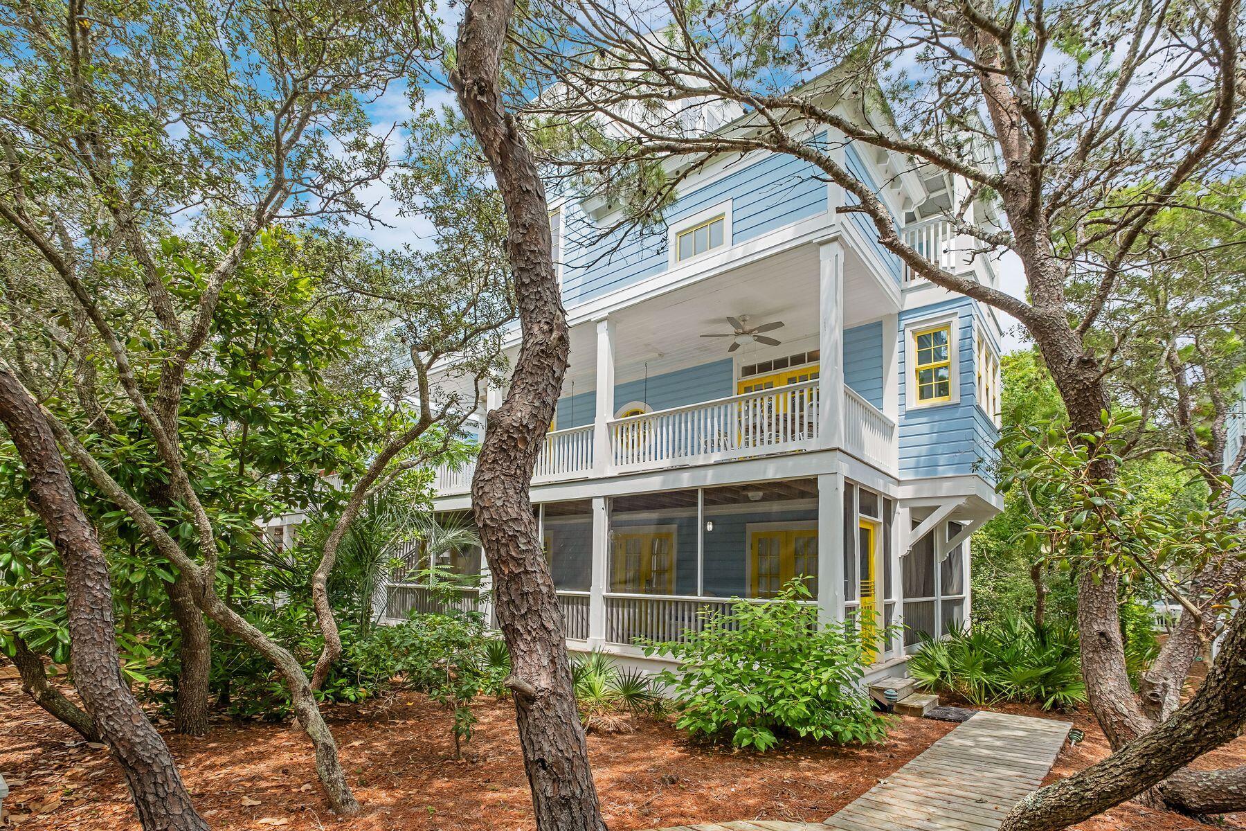 Experience unparalleled coastal living at Seaside Dreams, an exquisite property in the heart of Seaside, Florida. This unique offering comprises two charming cottages, American Dream and Another Dream. A Tower view in American Dream is among the best of towers in Seaside, perfect for sunrises and sunsets. Adorned in patriotic red, white, and blue, American Dream exudes charm with architectural details like vaulted ceilings, spiral staircases and built-in bookcases. This cottage shares running porches and balconies with its sister cottage, Another Dream. The second floor houses the main living and dining spaces, featuring a spacious family room, dining area, full kitchen, laundry room and a full bath. Upstairs, the loft space includes a trundle bed, while the first floor offers two guest