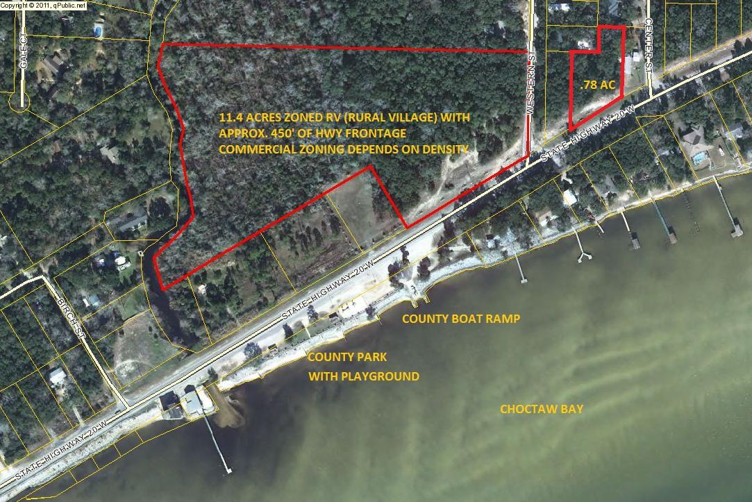 Beautiful wooded acreage located along scenic Hwy 20 and corner of Western Street with views of Choctaw Bay. Across the street from the Public park and boat launch. Land is zoned RV (Rural Village) with 2 residential units per acre. Commercial zoning depends on the density of commercial. Parcel can be divided into 6 lots (75'x208') fronting Hwy 20 and lot 7 on Western Street which is larger. Survey available and Buyer to verify all dimensions. See lot layout for lots 1-7 and proposed subdivision layout for 19-lots under documents. City water only available.Also, the Seller has an additional .78 acre parcel to the East of this parcel also for sale (MLS #761612.)
