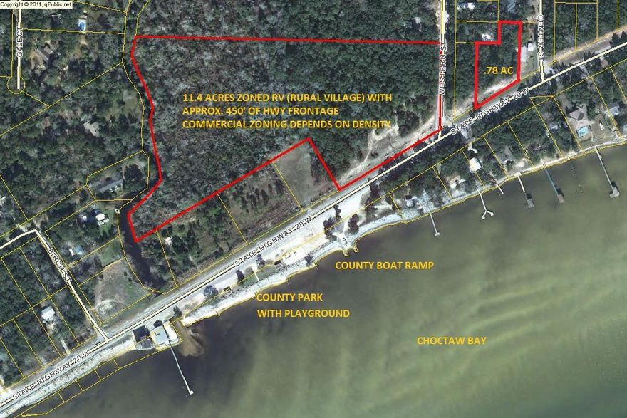 Beautiful wooded acreage located along scenic Hwy 20 and corner of Western Street with views of Choctaw Bay. Across the street from the Public park and boat launch. Land is zoned RV (Rural Village) with 2 residential units per acre. Commercial zoning depends on the density of commercial. Parcel can be divided into 6 lots (75'x208') fronting Hwy 20 and lot 7 on Western Street which is larger. Survey available and Buyer to verify all dimensions. See lot layout for lots 1-7 and proposed subdivision layout for 19-lots under documents. City water only available.Also, the Seller has an additional .78 acre parcel to the East of this parcel also for sale (MLS #761612.)