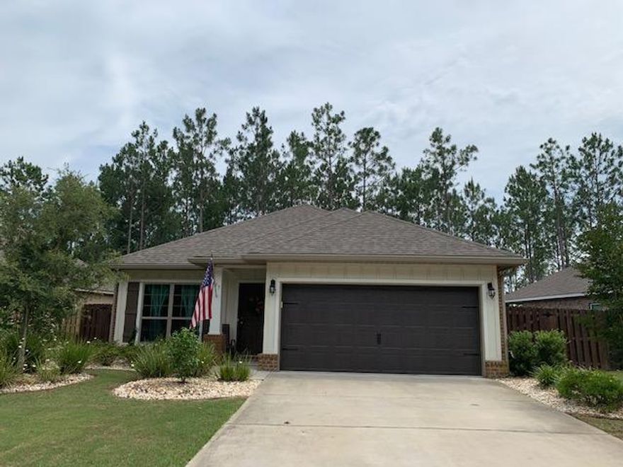 Enjoy the tranquility of this home which is located on a cul de sac and backs up to a preserve area. This immaculate 3 bedroom, 2 bath offers so many upgrades;Tile flooring throughout all rooms except the bedrooms are carpeted. Gas range, fireplace, water heater and dryer. All appliances including the washer, dryer and refrigerator remain. Crown molding and window blinds throughout. Garage has pull down stairs for attic storage and an exterior door leading out to a concrete pad. Screened porch overlooks an additional concrete patio and deck w/hot tub. Exterior features also include flood lighting, gutters and Privacy fence. Hammock Bay offers many amenities for the homeowners to enjoy. Miles of sidewalks and walking trails, Clubhouse w/theater, fitness center, sports complex, 3 pool