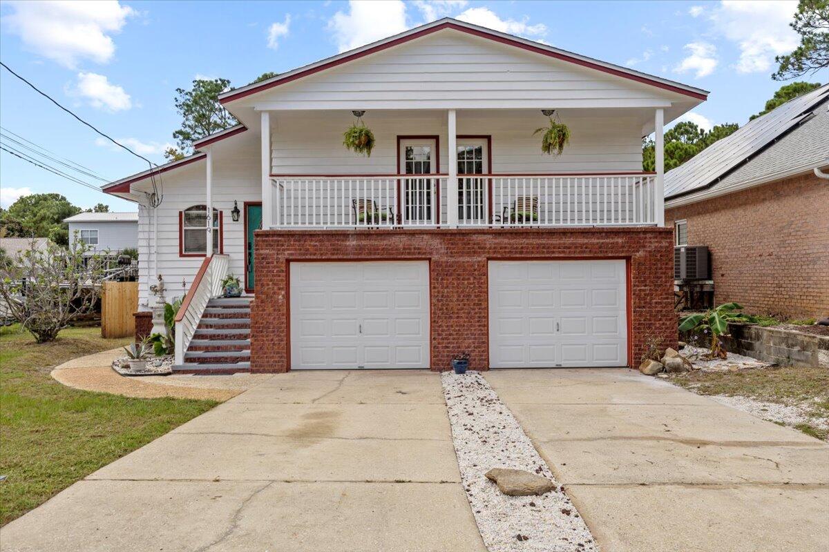 Experience refined waterfront living in Gulf Breeze. This custom specialty artisan craftsman home showcases soaring ceilings with exposed beams and a dramatic floor-to-ceiling stone fireplace, blending character with comfort. Updates in the last few years include a new roof, HVAC, insulation, flooring, paint, remodeled baths, and a smart security system. Outdoors, a reinforced concrete seawall, rebuilt dock, and drive-through garage with private boat launch make life on the water effortless. Enjoy sweeping views and relaxed vibes from two spacious decks, rinse off in the outdoor shower after a day on the water, and unwind in the massive primary suite. It is more than a residence--it's a rare opportunity to own a turnkey coastal lifestyle in one of Gulf Breeze's most coveted locations.