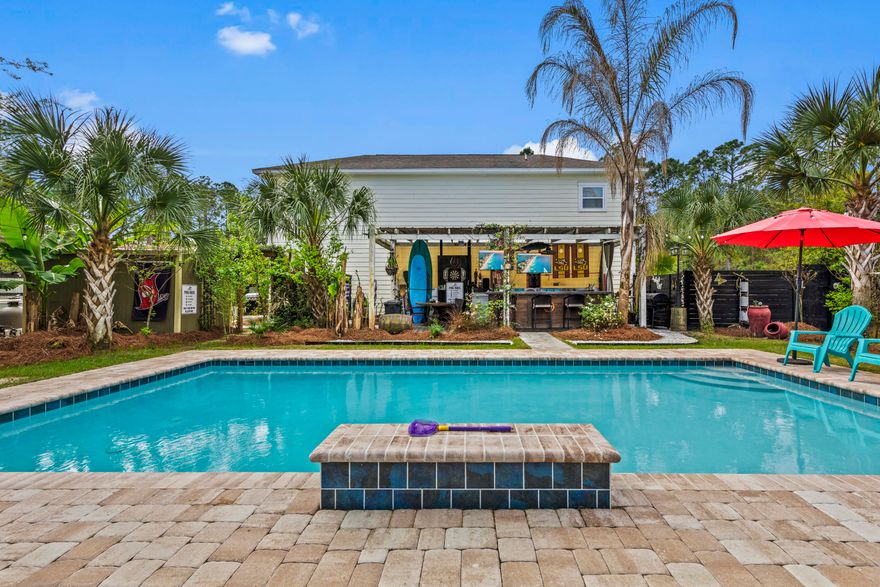 3 bedroom, 3 bath home plus tiny house on property with 1 bedroom, 1 full bath on an oversize lot (originally 3 lots) about .29 acres.  Each bedroom has ensuite, large closets and great views.  Beautifully landscaped fully fenced in property with large heated pool (30X15), full size bar with 2 TVs, multiple sitting areas and fire pit and outdoor shower.  Property is in a quiet community one block from the bay with no HOA.  Room dimensions are approximate.  Please measure, if important.