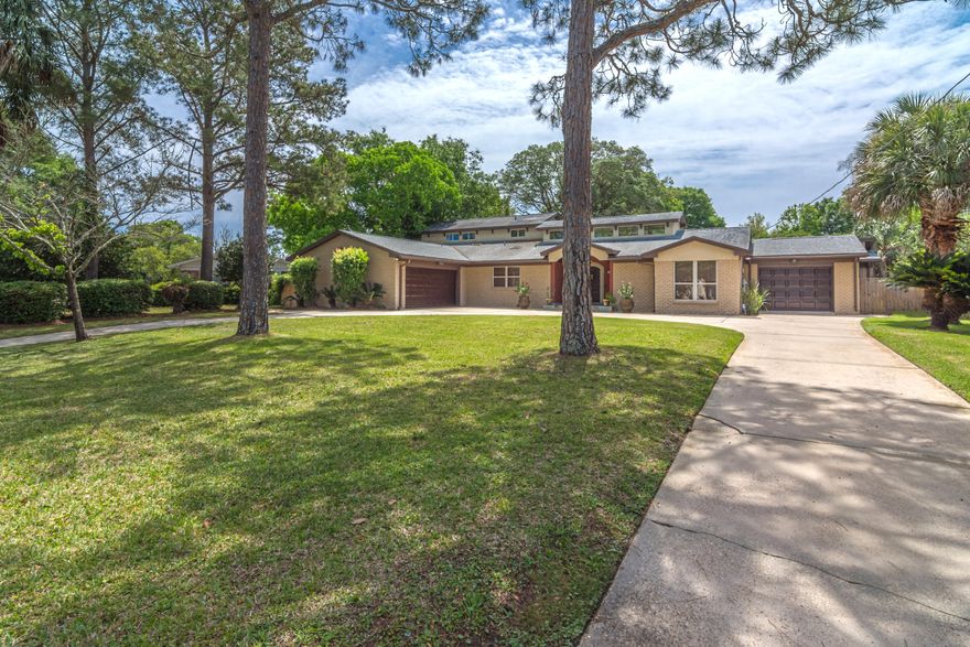 This beautiful & spacious Mediterranean pool home in the sought after Elliott Point neighborhood underwent extensive custom renovations in 2007. This 3420 sq ft home features 4 bedrooms, 4 bathrooms + an office & a 3 car garage making it the perfect home for those looking to spread out! The total square footage including garage and porch space is 5561 sq ft. There are 2 master suites and each master bedroom includes its own outdoor terrace. The gorgeous gourmet kitchen, with custom cabinetry, granite countertops, a large kitchen island and a built in desk is ideal for those whom love to cook and entertain. There are hardwood floors throughout the living spaces and carpet in the bedrooms.