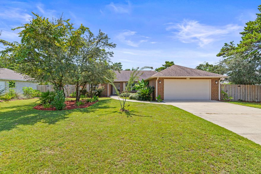 Fall in love with this vibrant, move-in-ready gem with no HOA! On a half-acre lot, this 2,024 sq ft stunner boasts 4 beds, 2 baths, and a spacious 2-car garage. The split floor plan ensures privacy, while the great room, with soaring ceilings and a fan, opens to a 10x16 covered porch-perfect for chilling. The kitchen dazzles with granite counters, custom cabinets, and stainless steel appliances. Your master suite is a cozy retreat with a spa-like bath featuring dual vanities and a huge shower. LVP flooring and tile throughout wet areas. The expansive backyard offers a beautiful and lush garden. Just half a mile from shops, eateries, and the serene bay, and minutes from the gorgeous beaches, this is your dream home waiting to happen! Call for details!
