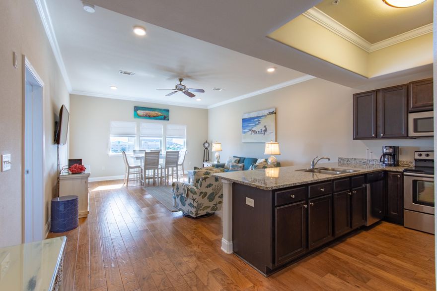 Lowest priced TOP floor, 3 Bedroom luxury condo in Alerio! Access to the white sandy beaches of Miramar Beach is directly across the street. This fully furnished condo is completely turnkey and would make for the perfect vacation rental or vacation getaway. Modern features can be found throughout including a full kitchen equipped with granite countertops, stainless steel appliances, oversized pantry, and stack washer/dryer in hallway. Hardwood and tile floors are found throughout the entire unit. Every room has a 58'' Smart TV. The ensuite master bath is complete with a double sink vanity, soaking tub and walk-in shower with frameless glass door.There are even gulf views from the living room! Amenities include a pool, hot tub, children's splash pad and a grilling area.  This wonderful unit is priced to sell quickly.  Don't miss this excellent opportunity to own your own slice of paradise along the Emerald Coast!  Please call today!