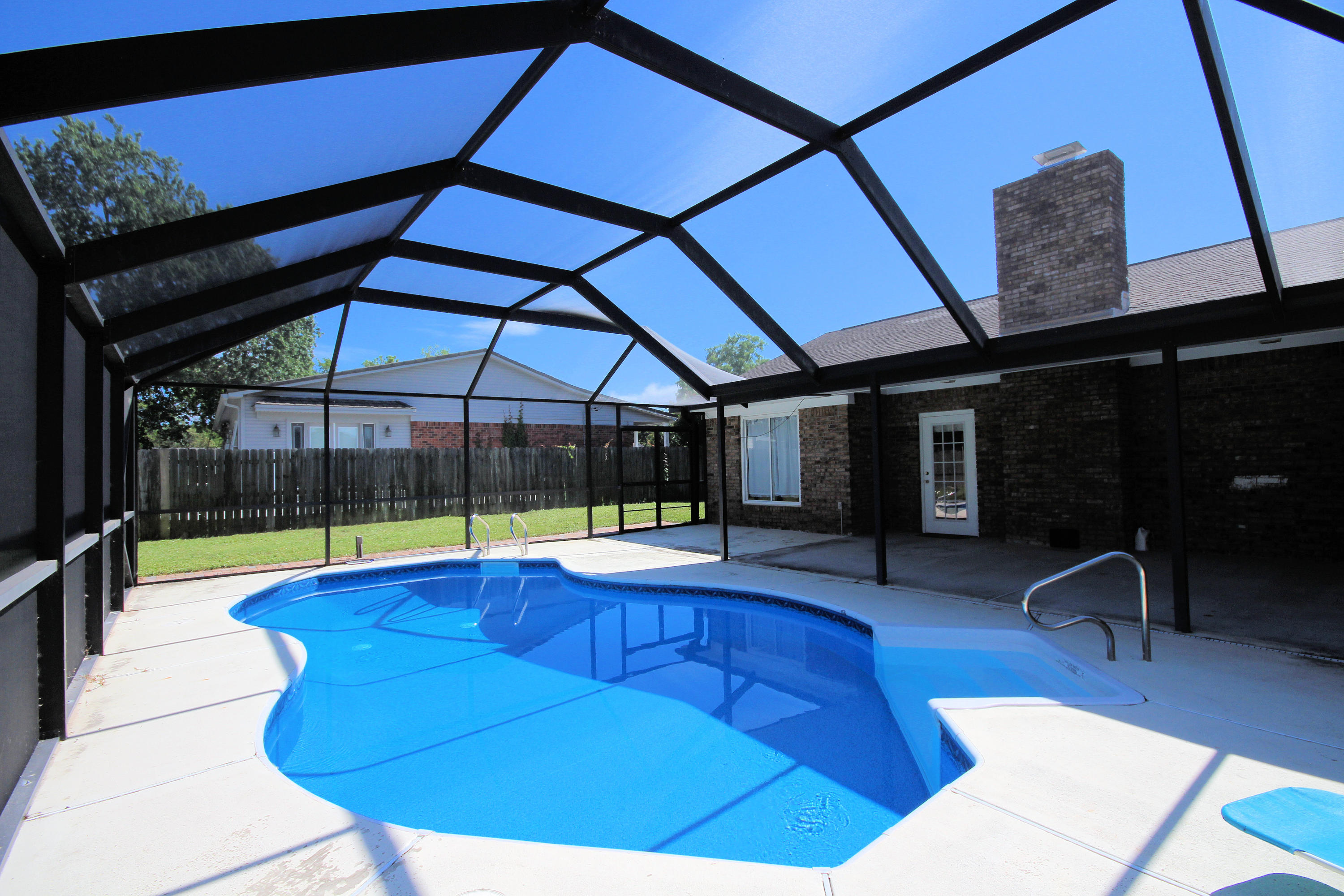 All Brick Pool Home on a Large Lot in Destin, FL! Convenient Location to Beaches, Shopping & Restaurants. Nice Established Neighborhood with 4 Newly Constructed Homes Across the Street. Large Living Room. Big Bonus Room. Giant Kitchen Area with Dining Room that Overlooks the Pool. Spacious Additional Bedrooms. Large Master Suite. Nice Big Laundry Room. Walk-In Pantry or Small Personal Office. Massive Screened-In Pool area Perfect for Entertaining. You'll Love the Outdoor Living! Double-Hung Windows. New Pool Liner. Big Paver Driveway with Room to Park a Boat AND an RV and still room for the cars. Wonderful Covered Entry. Big Yard Building With Power! Could Be Used as a Workshop.This is a Lovely Home and Shows Better in Person! See it Today!Buyer to verify measurements. Seller is Lic Agen