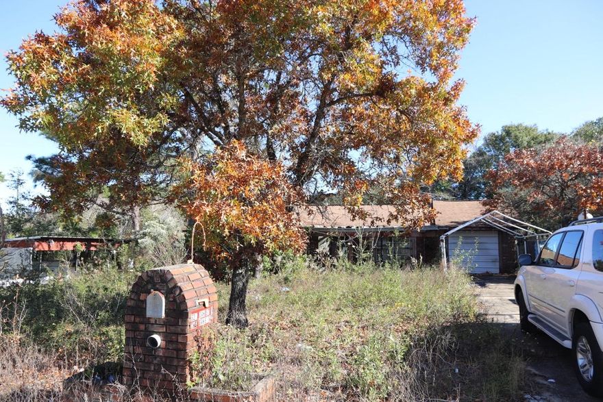 BRICK HOME - MAJOR HANDIMAN SPECIAL. This home needs lots and lots of work. Working on getting the debris cleared out. BUT IT HAS 1,728 SQFT ON SLAB. The lot is very large, 100x150. Even if you spent $75,000 on renovation in this home, you would still only be in it around $125,000 and it would be like new (still way under $100/sqft). OWNER FINANCING AVAILABLE WITH $25,000 down. (Finance $28,900 at 7% for 30 years = $192.27 monthly payment).