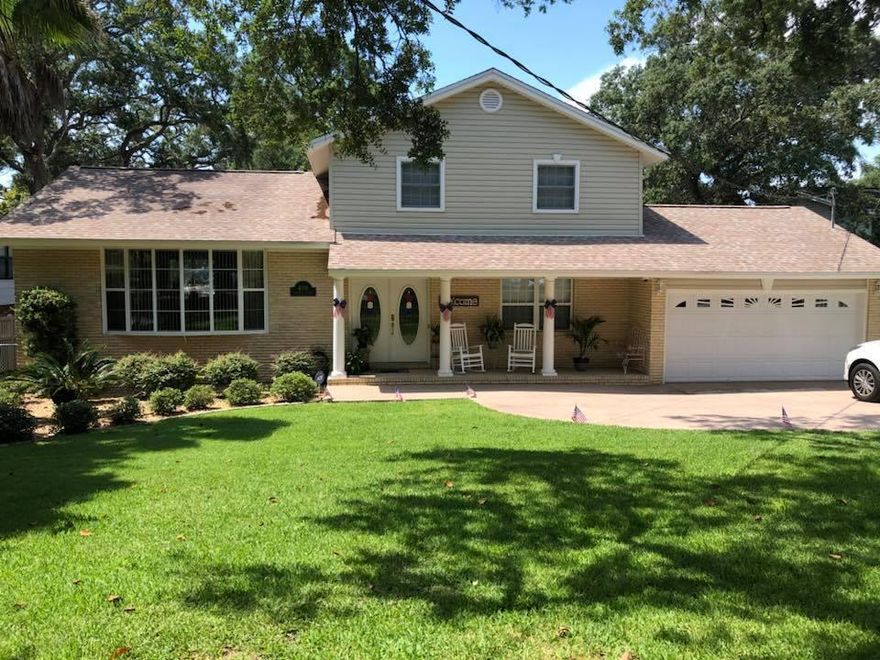This wonderful bayou front home not only has 80 feet of deep water frontage, but is located on a cul-de-sac. The lot is high and not in a flood zone. Beautiful bayou views from many rooms inside the home compliment the many outside terraces with water views. This four bedroom home has been maintained and improved by the current owner. The heating and cooling system is geo-thermal (one unit is new) making for very reasonable utility bills the owner states. Some other features are a custom entertaining area (man-cave) with a custom wet bar. The bar features a full size side by side refrigerator. Antique tin wainscoting adds to the charm of this area. Set up for multiple TVs, darts and other recreational possibilities while enjoying the water views. This room has a large closet system for