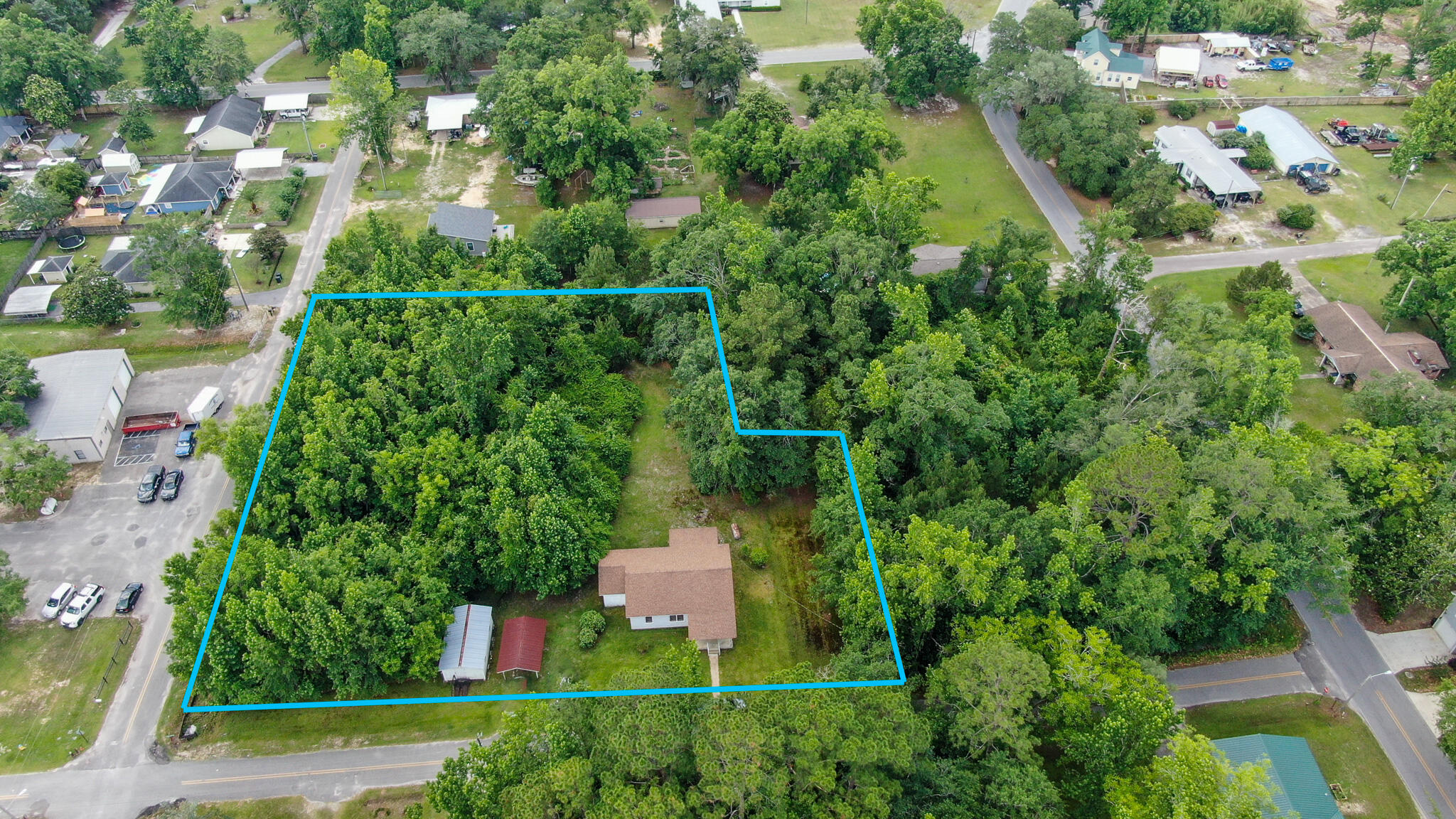 Check out this older home on almost an acre in the heart of town. The real value is in the almost acre of land. Check with the city of Freeport planning department on possibly changing the zoning to allow for townhomes on this huge lot.