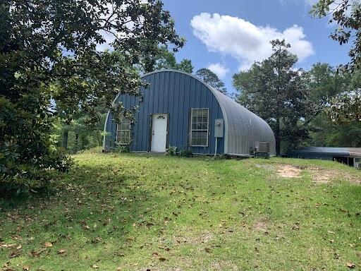 Are you looking for a unique property? Good! You have found it! This all metal home is fully insulated, 1 bedroom, 1 bathroom and a loft space above the living area. The property is situated on Racoon Bayou and features a car port, covered deck and a boat ramp. This listing includes 2 parcels, the second parcel ID is: 17-1S-28-3340-00300-0090 it is the lot immediately beside the property with a building on it.