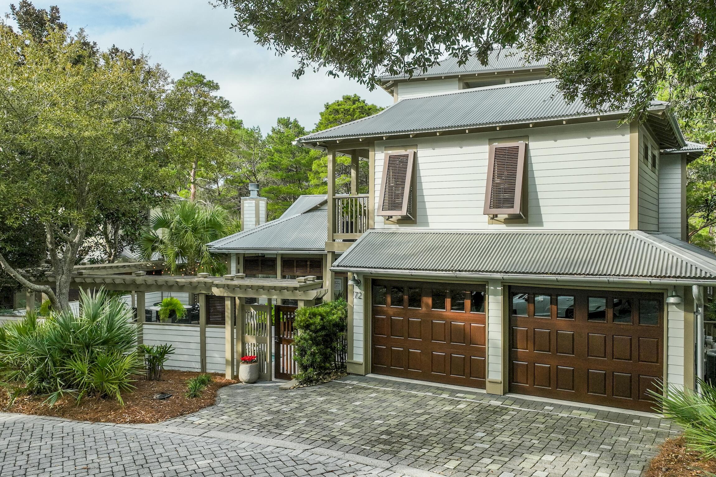 What an incredible opportunity to own a BEAUTIFUL HIDDEN GEM! These homes do not come available very often and this one has it all. This beautifully renovated 4 bedroom home is located in the gated community of Summer Ridge. Its comes complete with a carriage house, 2-car garage,  and a heated pool. Upon entering the private courtyard you will be greeted with a serene ambiance of the pool, new shell stone patio, Fire table, and privacy. Enter through through the double coffee stained wood and glass doors and you will find a vaulted wood beamed ceiling, gorgeous windows, and wood floors. The Great Room is open to the kitchen and dining areas for maximum spaciousness. The kitchen is delightful with a gas stove, french door refrigerator, microwave and a built in ice maker. Make your way