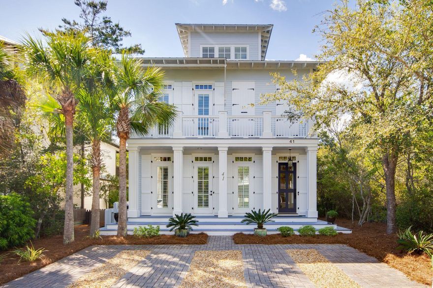 This distinctive three-story beach home in Seacrest Beach is eloquently designed by Domin Bock Architects and built to the highest standards by Urban 86. Situated on a quiet street, it is in a sought-after area within easy walking or biking distance of the beach and local amenities. The 12,000 square foot resort-style pool is steps away, making it easy to enjoy a morning swim before breakfast or hang out with neighbors in the afternoon sun. Photographs barely do justice to the professionally decorated interior with rich walnut floors and white cypress ceilings. The generously sized open living room incorporates a gourmet kitchen and dining area. Designed for entertaining, the living space flows seamlessly outdoors onto the balcony for evening drinks and hors d'oeuvres with treetop views.