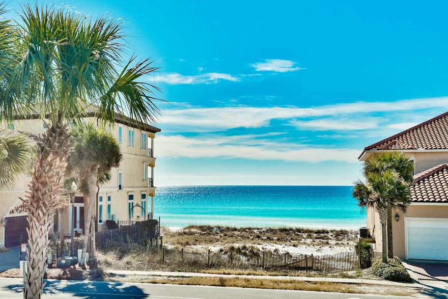 Welcome to the new ''Emerald Palace'', one of Grand Palms' many exclusive luxury houses. This mediterranean inspired beach house proudly claims it's win in the Parade of Homes. Designed and built by well-known Dixon Kazek Fine Homes, this masterpiece showcases superior upgrades, has been professionally decorated with the highest quality furnishings expected in a luxury home. Every bedroom is lavishly complete with private bathrooms and balconies.Well over 4,000 square feet, the ''Emerald Palace'' has two exquisite master suites, beautiful first floor living room, five additional spacious and equally beautiful bedrooms to comfortably accommodate several guests or family. Exquisite crown molding, lovely tile flooring, hardwood flooring throughout all bedrooms and stair well, recessed lighting, two brand new dehumidifier systems, entire interior has been completely repainted. Perfect for any lifestyle, whether your primary residence, vacation home, or as an investment rental machine, this beach mansion also comes complete with heated salt water pool, large two car garage, and views of the beach from every south facing window.  Nestled among the row of "Grand Palms", this pristine and polished piece of paradise is a must-see to appreciate.  Call today to schedule your private showing of this marvelous mansion near the beach!