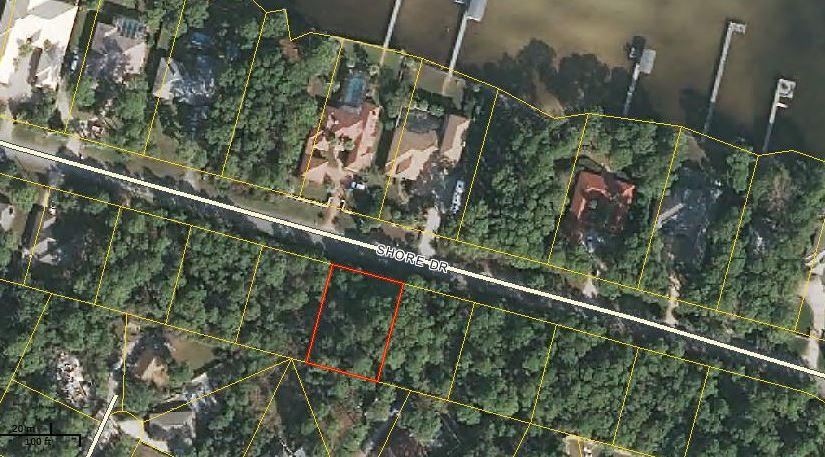 Located in Miramar Beach just across from the bay this heavily wooded lot will afford the homeowner some water views, no HOA fees and convenient to shopping, restaurants, movie theatre.Lot dimensions are 100 x 125 and Environmental Sciences has determined that the buildable footprint of a home is 30x50. Lots 5&6 are also available for an additional price.