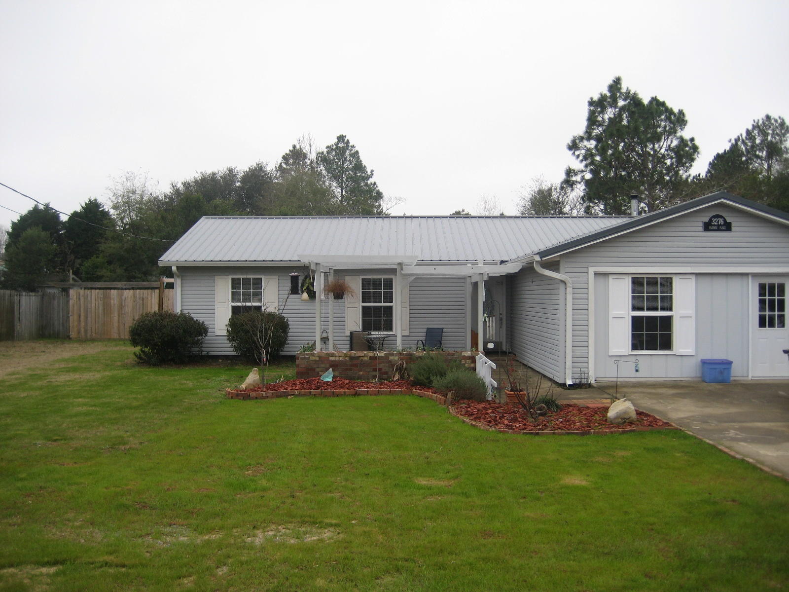 Nothing for you to do but move into this one! Wonderful 3 bedroom 2 bath home that has been updated and very well maintained! Tile in all wet areas, including the roomy kitchen with newer appliances. Great side-by-side refrigerator and matching stove/oven and microwave vent hood. Great island for prepping or just keeping the cook company! Master bedroom features a private bath with whirlpool tub/shower combination. Garage has been partially converted to add a family room, dedicated laundry room with ample storage and a great workshop for the handyman. Exterior features a great in-ground pool with deck and walkways throughout the back yard. Also you will find a screened Florida room and separate planting room for those with a green thumb! Raised beds throughout the back yard also!