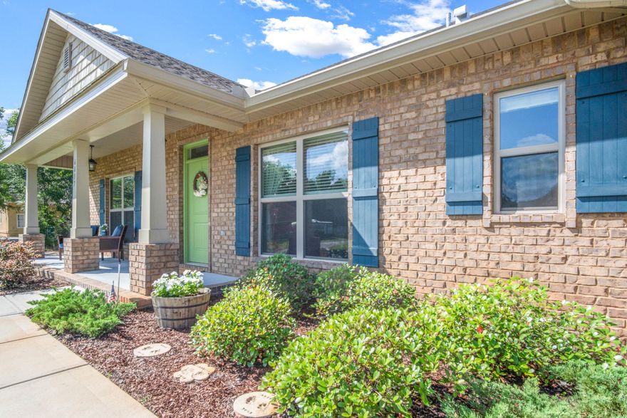 Welcome home to a well maintained Craftsman home that has many bonus features inside and out. There is a bonus fourth room with french doors that makes a great gym or office space. The home has a deep foyer entrance that features extra closet space and shelve cubbies for storage. The home has a charm and upgrades that were extra when constructing. The kitchen and bathrooms feature a thick white quartz with a baby blue glass backsplash. The flooring appears like wood and looks terrrific along this open floor plan home. The master retreat is on the far right side of the home facing the beautiful backyard. Right before you step outside to your covered patio, they added a custom pet door on the home instead! Clean look and professionally installed. (continued)