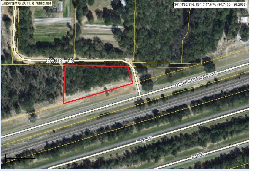 Great level wooded land located right on Hwy 90 with frontage on 2 roads. Would make an excellent home site or pursue commercial possibilities.