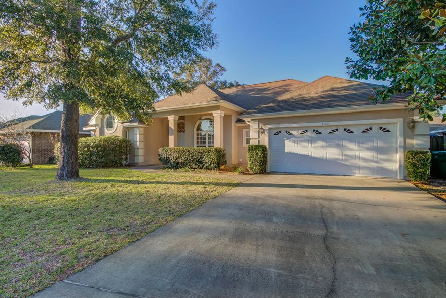 Custom finishes complete this 4 bed, 3 bath home in Bluewater Bay. With an open concept, this home incorporates indoor/outdoor living with a large screened in back patio with double slider glass door off the living area. Tile floors throughout the main area features a custom mosaic inlay at the entry. Upgraded details were selected and quality crafted throughout the home including a BUTLERS PANTRY with built in wood shelving, open kitchen with built in WALL OVEN and separate cook top and GRANITE counters. The master suite has a tray ceiling in the bedroom with rope lighting and a beautiful vaulted ceiling in the master bath with a circular window bringing in tons of natural lighting. The walk in tiled shower and separate corner jetted tub along with separate vanities provide ample room to get ready.  On the opposite side of the home are 3 additional bedrooms, 2 with a Jack and Jill style bathroom.  The 4th bedroom is conveniently located adjacent to the 3rd bathroom with an exterior door to the privacy fenced back yard.  There's also a bonus space currently being used as an exercise room, but could function as an office, playroom, den or whatever you may need.  This home is conveniently located within walking distance to the Marina and beach area for launching your kayak or paddle boards. Come see this home today.