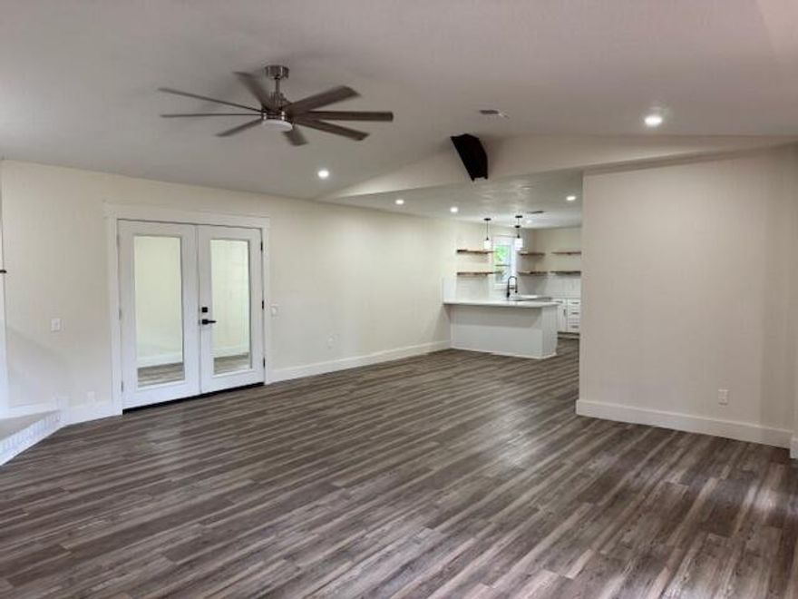 Welcome to this completely remodeled 4-bedroom, 2-bath brick home in the heart of Destin! The open floor plan features a cozy living room with a brick fireplace and a beautifully updated kitchen with stainless steel appliances, quartz countertops, and a kettle faucet over the stove. A versatile walk-in pantry can also serve as a home office or craft room.Bathrooms showcase shiplap ceilings and skylights for natural light, while the brand-new LVP flooring and barn doors add modern charm. Relax year-round in the large enclosed porch with heating and air conditioning. The spacious fenced backyard and unique rear-entry garage provide privacy and convenience.Minutes from the Destin Harbor,  shopping, restaurants,  restaurants, schools, beaches, Hurlburt Field AFB, Eglin AFB, NAV School EOD