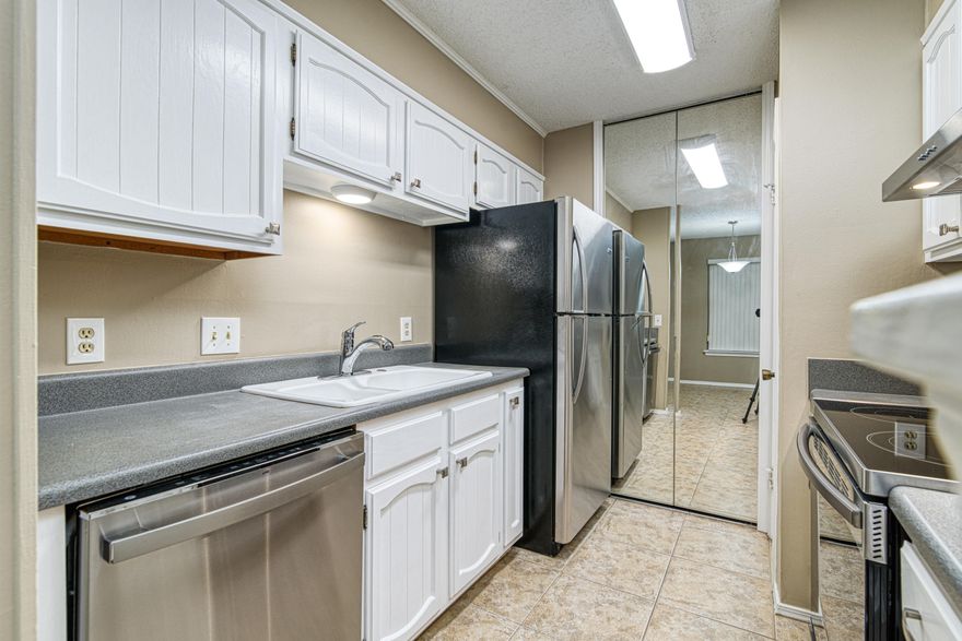 Conveniently located on Scenic Hwy in Windchase Condominiums, this first floor unit has 2 bedrooms 2 full bathrooms which offers comfortable condo living. The kitchen comes equipped with BRAND NEW stainless steel appliances with a 5 burner electric smooth range cooktop as well as a new hood vented to outside. New stainless steel backsplash added behind the stove, new kitchen hardware, new LED lights and freshly painted cabinetry with a pantry. You'll also enjoy the covered patio with privacy fence with a side gate entry and storage room/workshop with lock. The master suite features a sizable walk-in closet, double vanity with a shower/tub combo. The additional bedroom has two closets and the second full bath has a shower/tub combo. Other notables are LED lights throughout, ceiling fans, wa