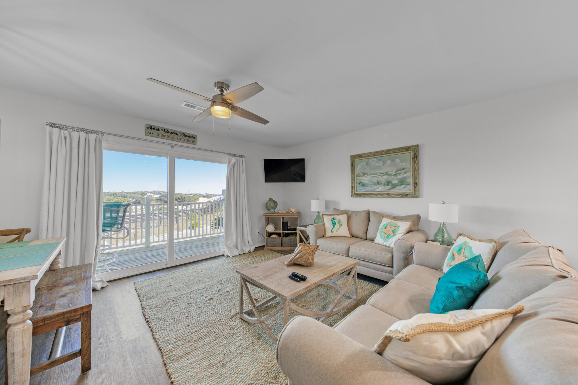 This immaculately remodeled town home at Shoreline 9 Townhouses looks directly across Camp Helen to the Gulf of Mexico. This low density building seldom becomes available, with the unspoiled views of our dunes, the gulf and Lake Powell, Florida's largest coastal dune lake, this allows access to all of these, add porches off of each bedroom and the main living area which make this charming home perfect for a rental or home. This townhome is light and it feels very private and it is located on the east end of Inlet beach and just steps to the sugar sand with a beach walkover and covered parking. Home has its own washer and dryer and an outdoor shower to rinse off our sugar sand before coming inside.