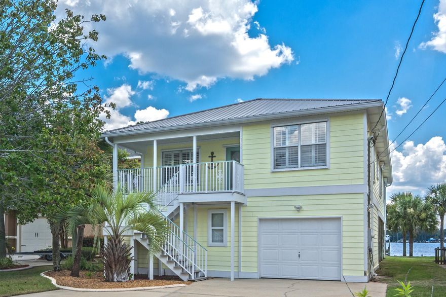 The best of Florida living! This traditional coastal design home serves perfectly as a primary residence or as a holiday retreat. Tucked away from busy streets and roads on a cul-de-sac, along the shoreline of Niceville's renowned ROCKY BAYOU. Facing east over the DEEP WATERS. The main living spaces are set up high on the second floor where you will enjoy some of the most spectacular views of the bayou and the bay. The lower level's recreation room w/kitchenette, the additional full bathroom, and the bonus room compliment the covered patio and backyard, making this home perfect to host large gatherings of family & friends. There is plenty of storage space for all the water ''toys.'' There are 2 x BOAT LIFTS & 3 x JET SKI LIFTS. No pool needed- plenty of water to swim in on the shore ... you can even set up the volleyball net in the water. This home delivers everything you want and more! 