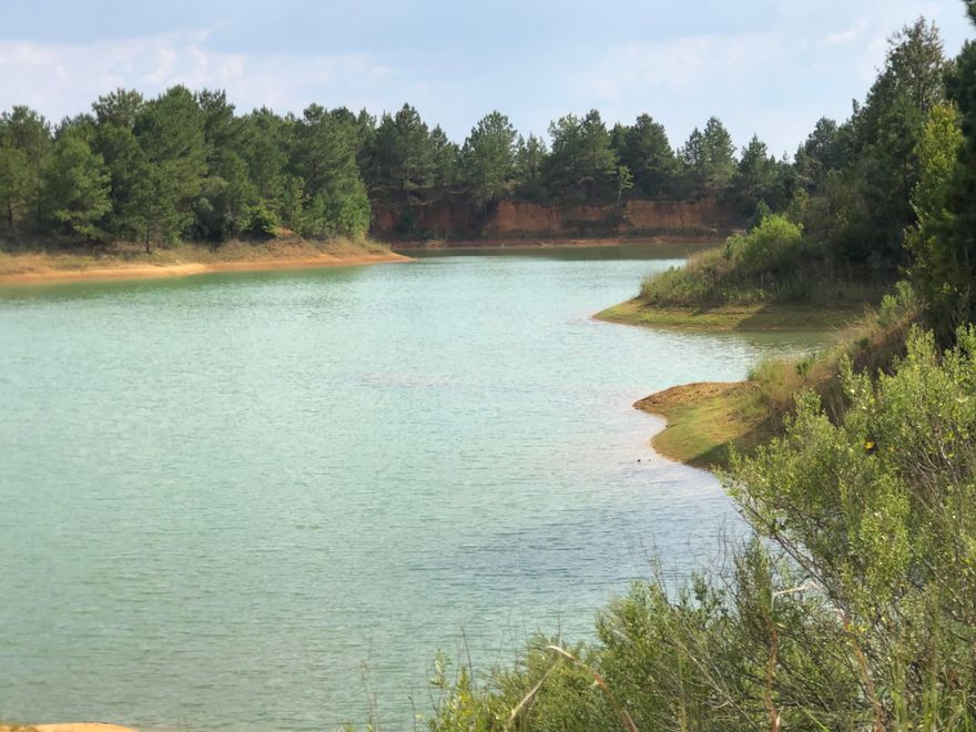 3 +/- acres outside of Uriah! 2.8 +/-acre portion of Parcel # 51-38-03-06-0-000-010.003. Bring your house plans! Paved road frontage. Power is next door. Lake front!