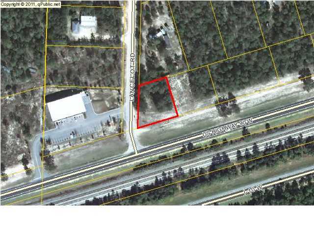 Substantial Price Reduction! Vacant wooded lot adjacent to the General Dollar Store in Mossy Head. Hwy 90 frontage and cornering Lancelot Rd. Estimated traffic count 5400 per day. Great Investment! Public water and electricity at road. Buyer is responsible to verify utilities, schools, zoning, dimensions and any other matters of importance.