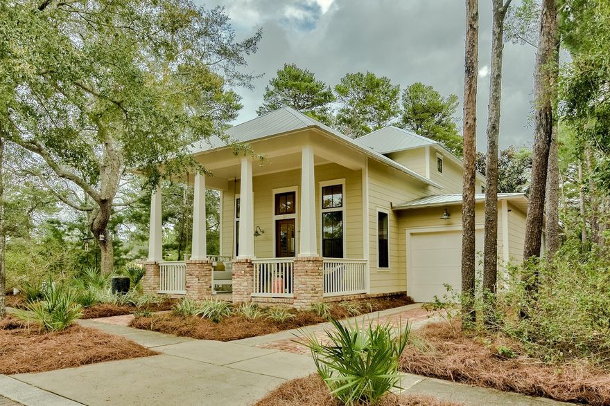 Forest Lakes Beauty! Welcome to this Florida Coastal Cottage in the gated quaint community of Forest Lakes. It is only a short walk to the sugary sands and emerald waters of the Gulf of Mexico. Enter the home from the spacious front porch into the open floor plan. The living/dining area has a spectacular vaulted ceiling, gas fireplace and shiplap walls. There is an overlook from the second floor which expands the space even more. The open kitchen boasts stainless appliances, quartz countertops and a custom pantry. The first-floor master suite opens onto a large screened porch that feels like a second living space. It has a mounted tv with seating and dining areas. This porch is also accessible from the butler's pantry/laundry room. The master bath has an oversized shower, double quartz