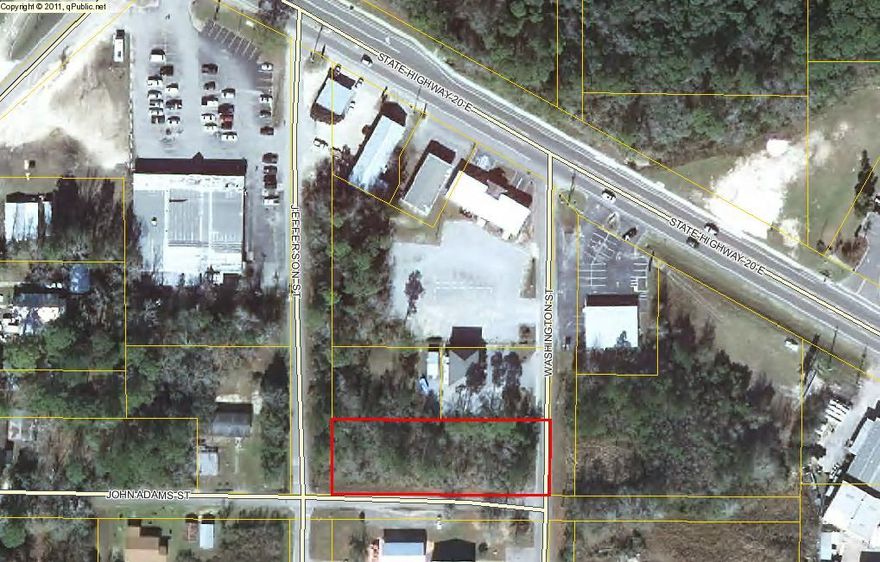 Great Commercial lot in the center of Freeport . Lot has street frontage on three sides with 90 feet on both Washington and Jefferson Streets and 260 feet on John Adams St .There are lots of possibilities for this property . Centrally located near many of the local businesses .