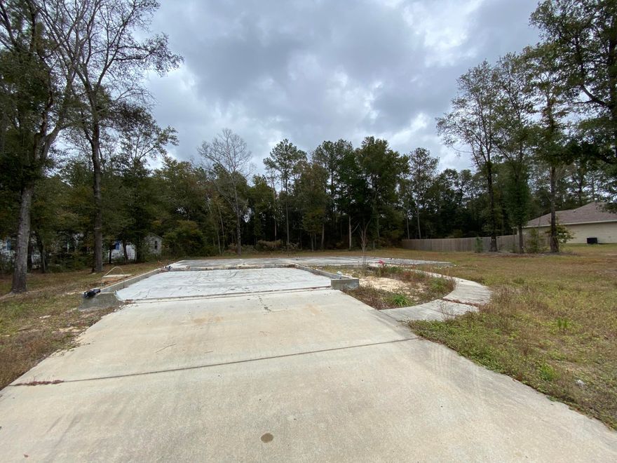 Large half an acre lot. There is an existing  foundation from a previous home. Perfect to build your dream home. There is intact driveway and sidewalks.
