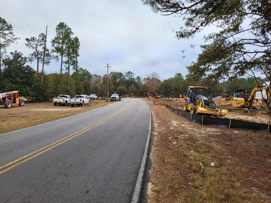 3.42 acres zoned commercial with approx 110 feet of paved road frontage.  Level site with several old buildings that are of no value.  Dollar General is under construction next door.  This lot is a portion of tax id#23-3N-20-28000-031-0010.  Some seller deed restrictions will be required.  See attached survey and aerial under documents.