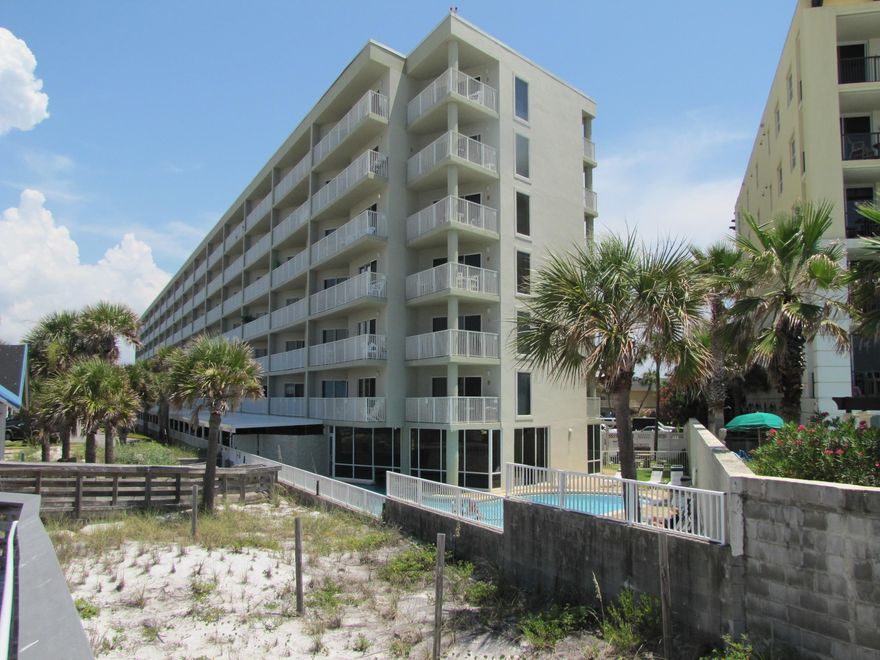 BEST price for a 3BR condo on Okaloosa Island!  Very close to the beach!  2 Bedroom with 1 Bedroom Lockout!  Rent as 2bedroom and 1bedroom or 3 bedroom!  Extra wide balcony and a slight view of the Gulf of Mexico!  Fully furnished and rental ready, this unit sleeps 8.  You'll love it!  Onsite amenities include a big indoor/outdoor pool, fitness center, and BBQ area all just steps from the sugar white beach of the Emerald Coast!  Private Covered parking spot under the building with an estimated value of about $10k included!  Not everyone has one.  Conveniently located on Okaloosa Island to restaurants, bars, and several tourist attractions to keep everyone entertained! Buyers should verify all measurements and information. Water, sewer, cable, internet, trash removal, and pest control